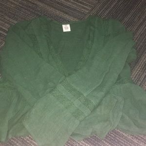 Green long sleeve that has a deep v cut